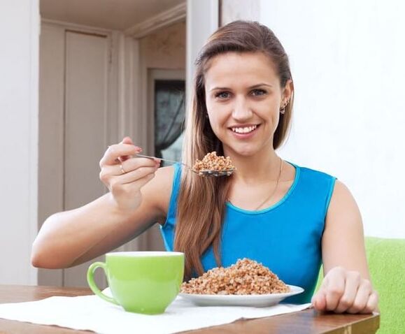 a girl eats buckwheat for weight loss